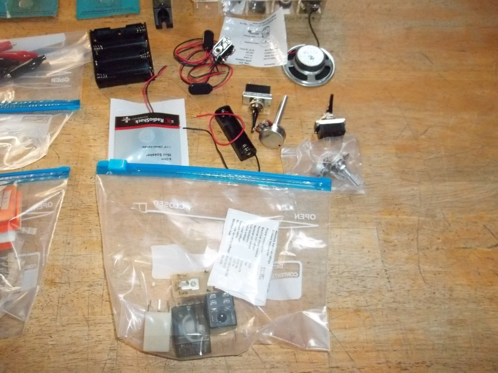 lot of electronics components, resistors, capacitors, relays, transistors, etc.