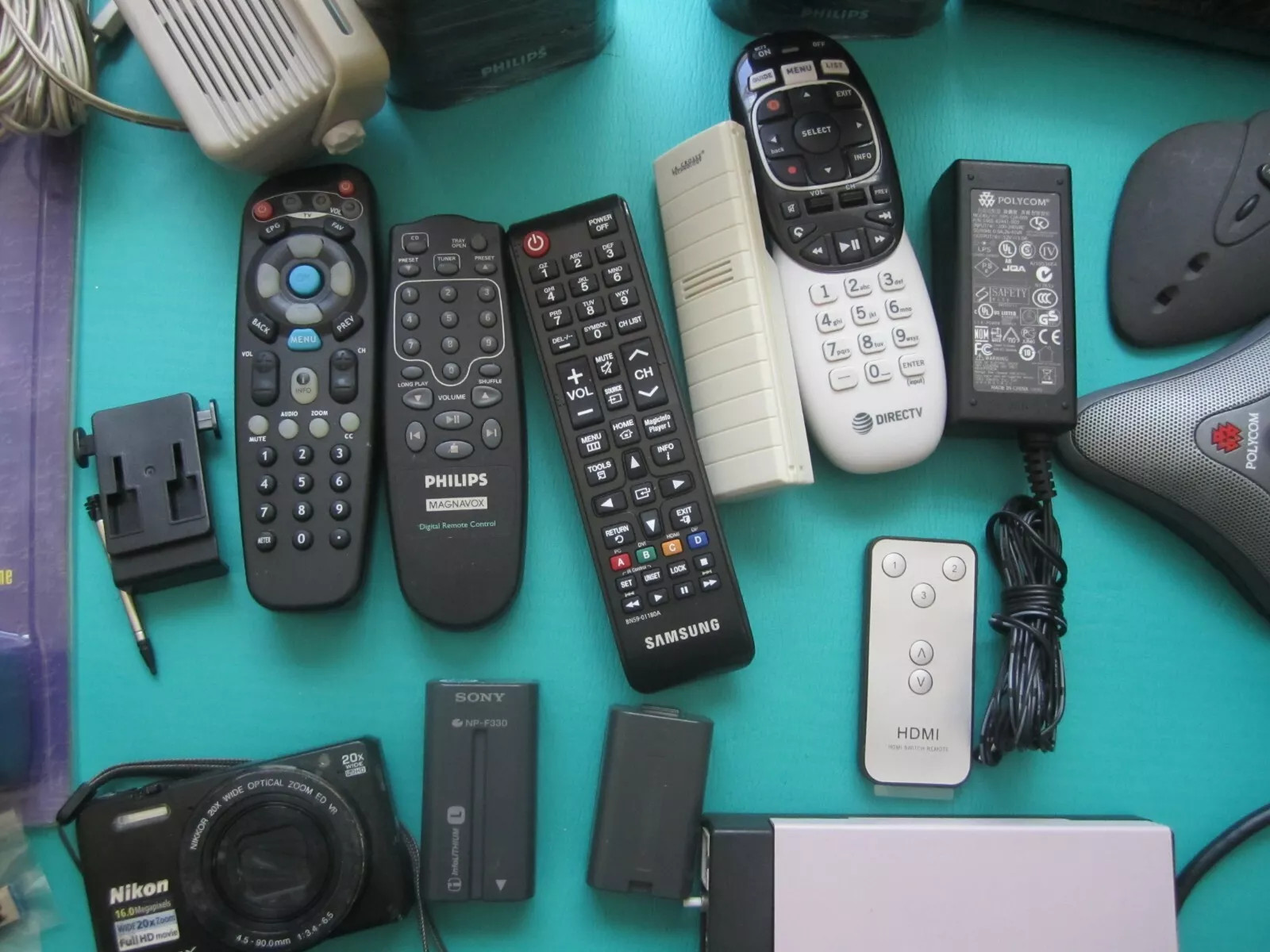 Mixed Lot of Electronics speakers, remote controls, batteries, and more W