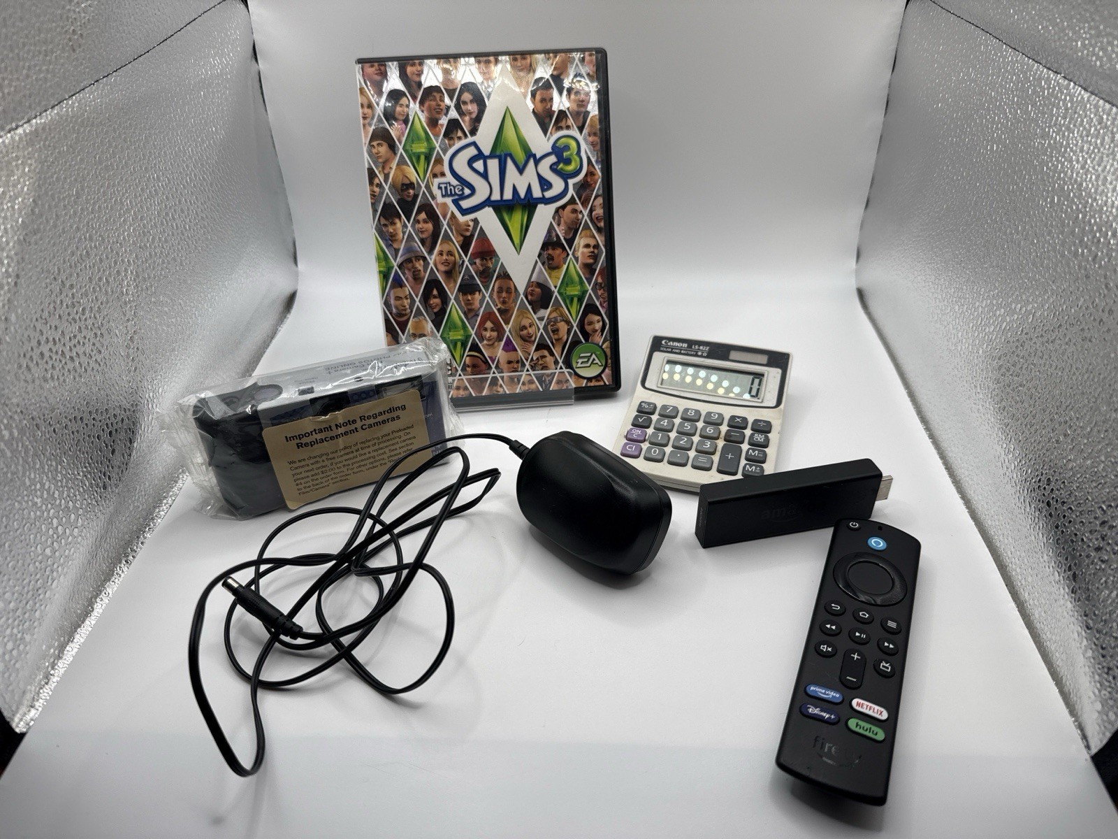 Mixed Electronics Lot Fire Stick Remote Canon Calculator Disposable Camera